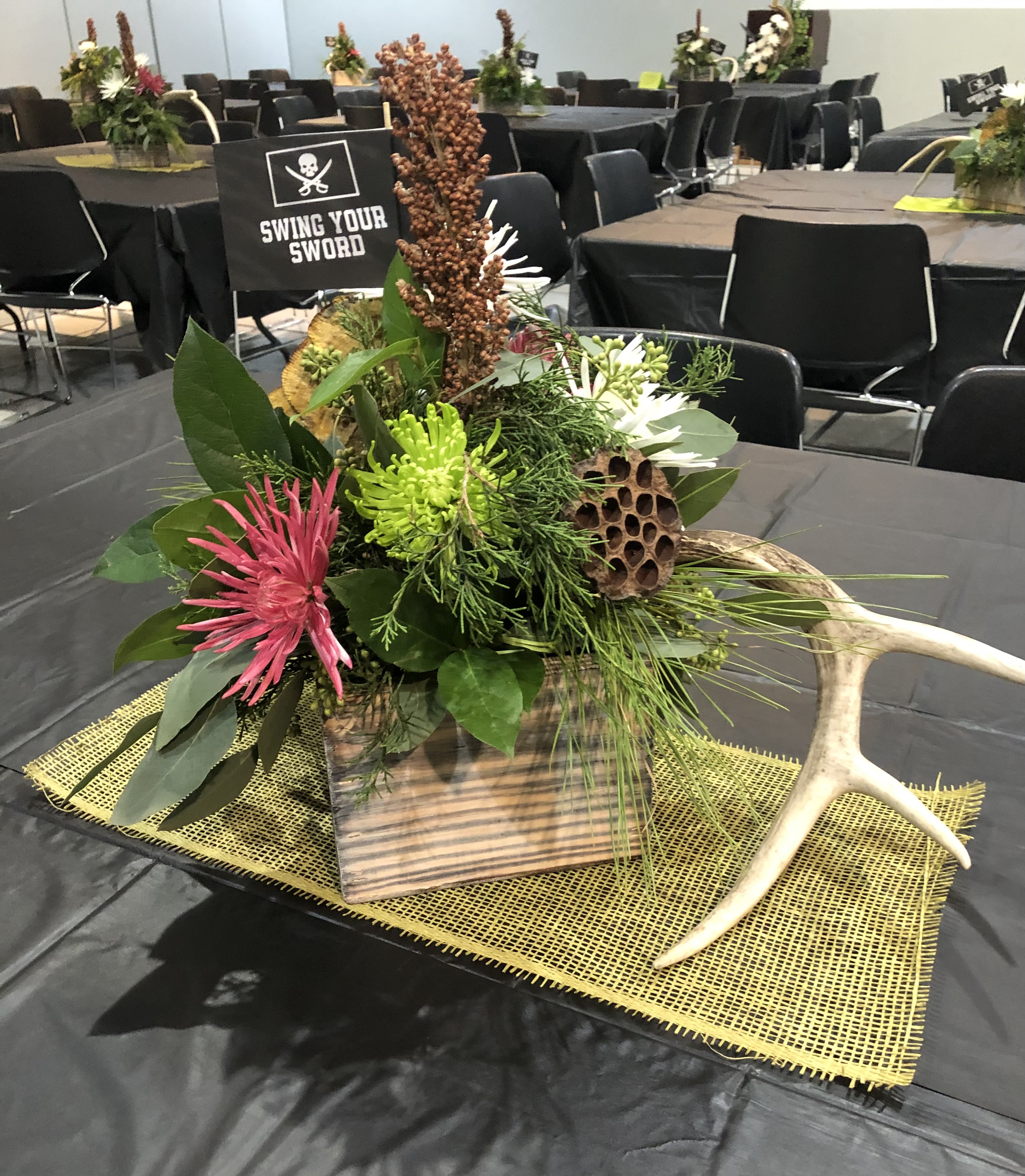  table centerpiece with the “Salute to Coach Leach” – “Swing your Sword” flag
